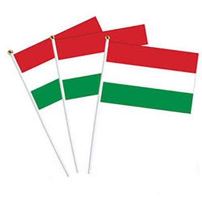 China Waterproof Wholesale Stock 14x21cm Ready To Ship Hungary Flag Hand Waving Flag With Pole for sale