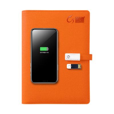 China A5 hardcover book orange leather wireless charging notebook with 8000 mAh powerbank and 16G USB flash drive for sale