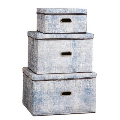 China Viable Hot Selling Household Wardrobe Quilt Storage Bins Faux Denim Fabric Organizer Metal Handle Lid Storage Box With Lid Different Large for sale