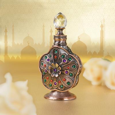 China Dubai Cosmetic Classic Arabic Style Round Luxury Metal Attar Perfume Essential Oil Bottle 10ml With Packing Case for sale