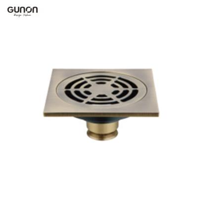 China Modern Gold Shower Drain Square Floor Drainer Insert Tiles Brass Hidden Floor Drain for sale