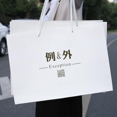 China Hot Recyclable Selling Boutique Shopping Bag The Chinese New Year Paper Bag With Logo Print for sale