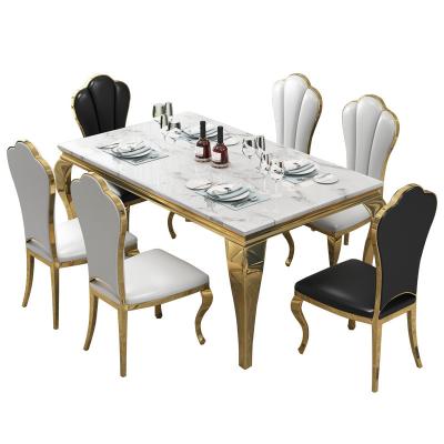 China Modern factory direct sales of gold-plated simple postmodern restaurant stainless steel marble dining table and chair combination for sale