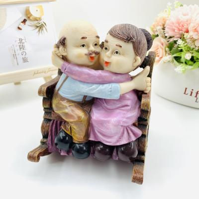 China Europe creative resin crafts loving elderly couples rocking chair old man couples home furnishing articles wedding gift for sale