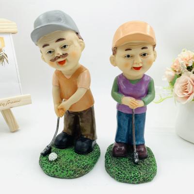 China Europe creative resin open play golf old man leisure couples elderly home furnishing articles wedding gift for sale