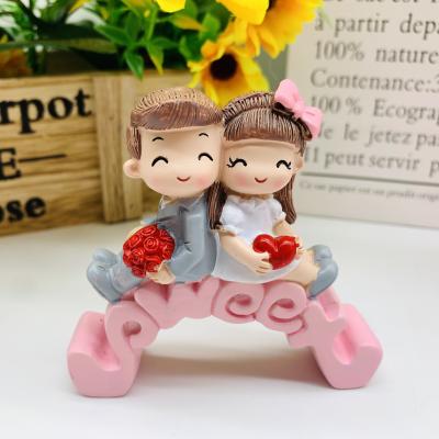 China China hot sale wedding gifts for guests furnishing articles resin crafts cartoon love couples cake ornaments and car ornaments for sale