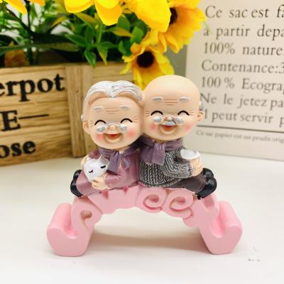 China China hot sale wedding gifts for guests furnishing articles resin crafts cartoon love old man cake ornaments and car ornaments for sale