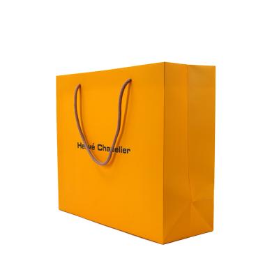 China Recycled Materials Wholesale Custom Luxury Shopping Apparel Gift Packaging Paper Bags With Your Own Logo for sale