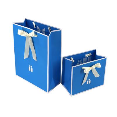 China Recycled Materials Top Sell Custom Ribbon Printed Logo Ribbon Bowknot Packaging Gift Wedding Paper Bags Eco Friendly for sale