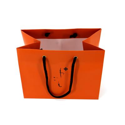 China Premium Recycled Materials Gift Paper Bags Carrier Bag Packaging Luxury Shopping Paper Bag for sale