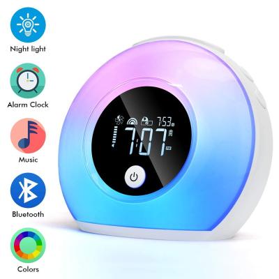 China Creative Hot Selling Sunrise Kids Wireless Wake Up Light Digital Alarm Clock Radio Blue Tooth Speaker with Night Light for sale