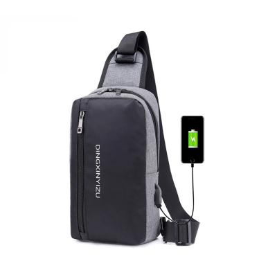 China Fashion Simple Design Large Capacity Men Sling Chest Shoulder Bag With USB Connection for sale