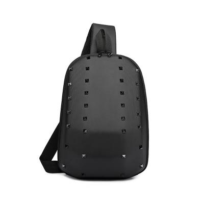 China Waterproof Men's Hard Shell Waterproof USB Rechargeable Cross - Body Bag Men Creative Personality Sling Bag Shaped Rivet Soulder Chest Bag for sale