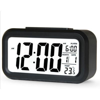 China ABS China Suppliers Large LCD Display Soft Digital Alarm Low Light Sensor Night Light Easy To Set And Observe Digital Alarm Clock for sale