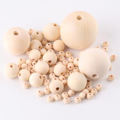 China Wood Around Large Christmas Tree 20mm Natural Unfinished Wooden Bead Garland Making Wood Beads Bulk For Crafts for sale