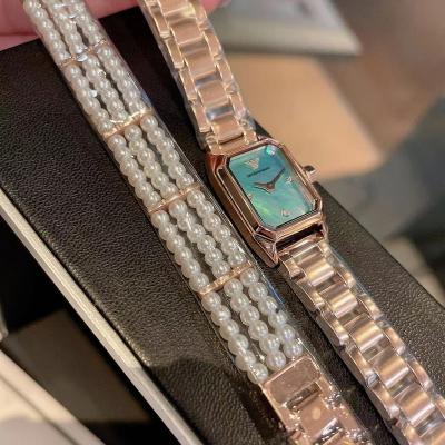 China Top Brand Water Resistant Full Diamond Custom Alloy Band Oval Quartz Wrist Watch Women Luxury Quartz for sale