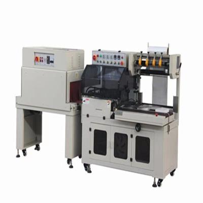 China steady & excellent performance electric heating shrink film packaging machine with sealing and cutting machine for sale