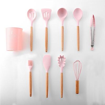 China Sustainable Utensils Supplier 11 Pcs Food Grade Silicone Pink Kitchen Utensils Storage Bucket Kitchen Utensils Set With Wooden Handles for sale