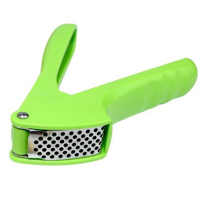 China Stocked Home Improvement Kitchen Tools Cooking Garlic Peeler Stainless Steel Press Garlic With PP Handle for sale