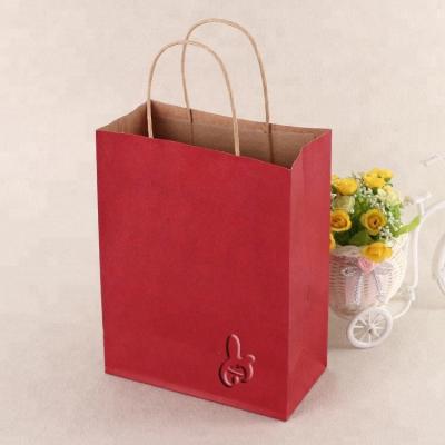 China OEM Logo Clothing Store Gift Paper Bag Color Kraft Paper Shopping Bag for sale