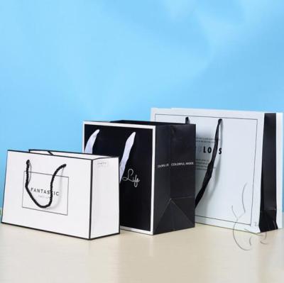 China Large Flat Bulk Recyclable White And Black Labeled Paper Bag for sale