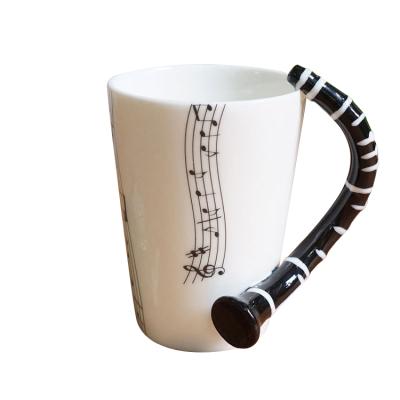 China Musical Art Handle Music Guitar Tarpul Mug Ceramic Mug Notes Holds Tea Coffee Disposable Single Milk for sale