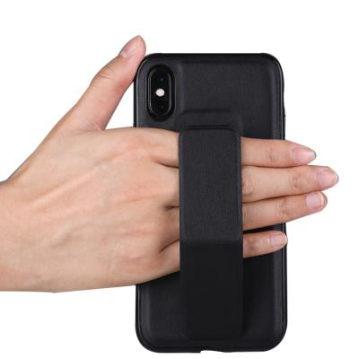 China Premium Shockproof Leather Case with Magnetic TPU+PC Wristband Mobile Car Holder Phone Cases Covers for iPhone X for sale