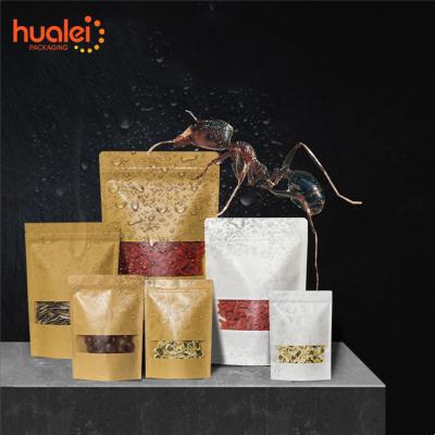 China Recyclable Brown Kraft Paper Stand Up Pouch Bags With Window Thickened Kraft Bag Nut Tea Dried Fruit Sealed Bag for sale