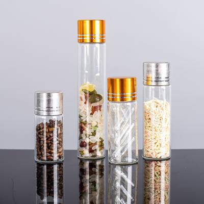 China Bill 22mm Diameter Blow Tube Glass Clear Jar With Lid Dry Goods Storage Gold Aluminum Bottle for sale