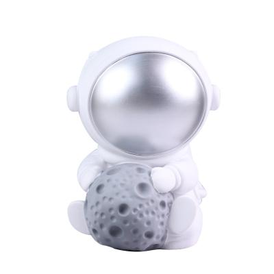 China Wholesale Luxury Vinyl Piggy Bank Astronaut Mini Ornaments Cartoon Astronaut Car Figure for sale