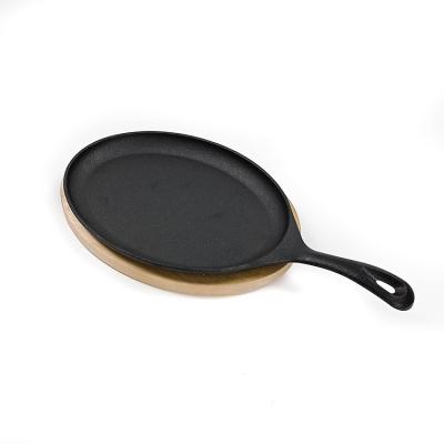 China Disco BSCI de Matt Black Cast Iron Sizzle con el Fajita bajo de madera en venta