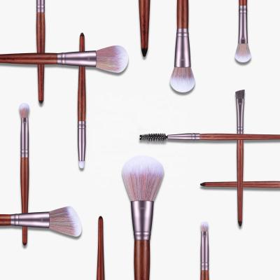 China Angular Blush 11 Handle Makeup Brush Set Sandalwood Eye Brush Mixed Color Bristle Beauty Makeup Tools for sale