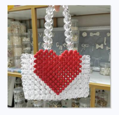 China 2021 Chinese fashion manufacturer produced CIA style red love acrylic beaded hand-carrying bag for sale