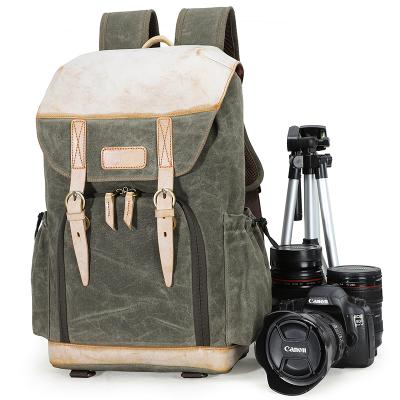 China Protective Effects Outdoor Vintage Canvas Leather Camera Backpack With 15 Inch Laptop Compartment for sale