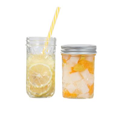 China Viable Iced Drinks Glass Mason Jars Canning Jars 16oz Coffee Mason Jar Glass Mug With Straw Lid for sale