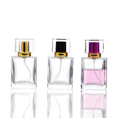 China Wholesale 30 ml 50ml custom luxury clear perfume packaging factory price square spray refillable perfume glass bottle for sale