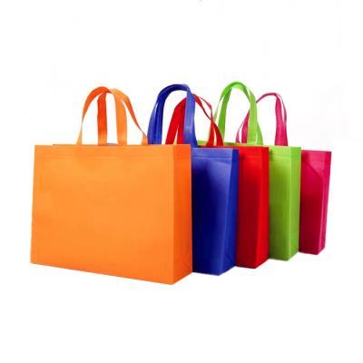 China Handled Ready To Ship Stock Promotional Colorful Non Woven Shopping Tote Bag for sale