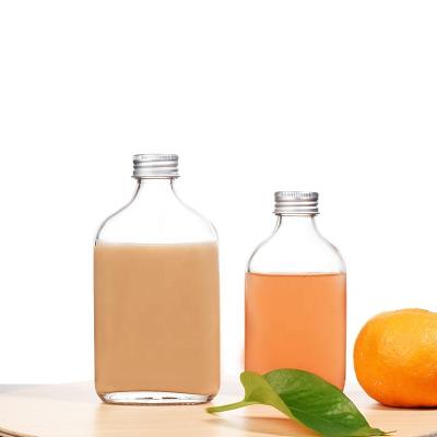 China Hot Selling Beverage JO Thickened Clear Empty Flat Flask Beverage Bottle With Metal Screw Cap For Juice Liquor for sale