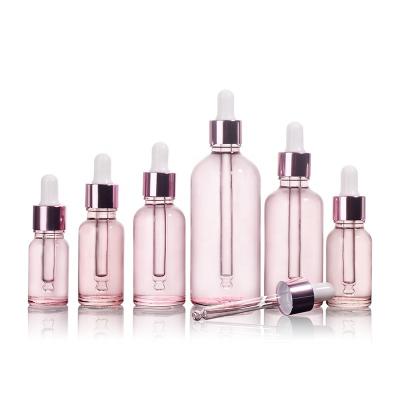 China JO Cosmetic Wholesale Luxury Pink Essential Oil Set Glass Bottle Serum Dropper Bottle For Personal Care for sale