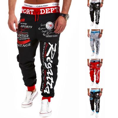 China Anti-wrinkle 2022 spring fashion men's drawstring waist sweatpants loose hip hop elastic letter print casual pants plus size men's trousers for sale