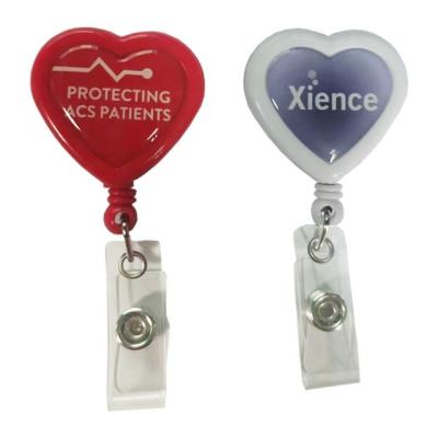 China Swivel Clip On Back Custom Epoxy Heart Shape Sticker ABS ID Badge Reel Retractable Badge Holder for sale