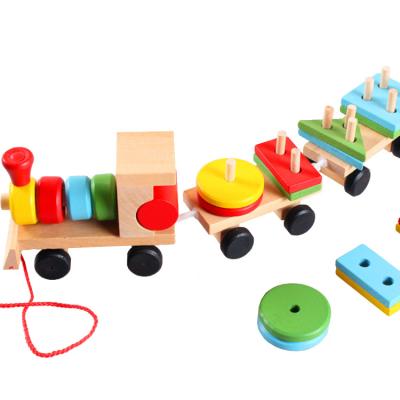 China Kindergarten Matching Wooden 3D Geometric Shape Building Toy Train Dragging Three Carriage Blocks Car Toy Vehicle Educational Toys For Children for sale