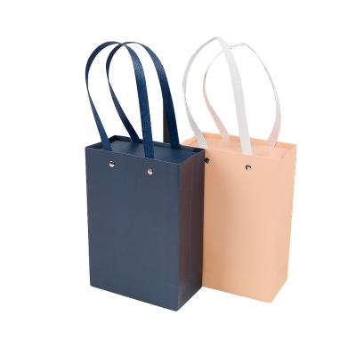 China Environmental Friendly Wholesale Cheap Price Customized Logo Kraft Paper Gift Packaging Bags With Handles for sale