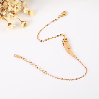 China FASHIONABLE Custom 18k Gold Plated Custom Titanium Linked Chain Feather Shape Steel Engagement Bracelet for sale