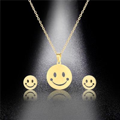 China FASHIONABLE Cute Smile Face Pendant Necklace and Earrings Set for Women 316L Stainless Steel Jewelry Set for sale