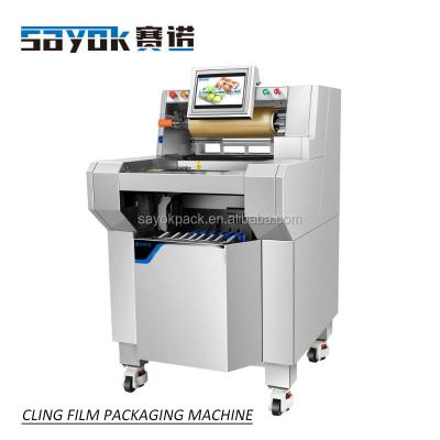 China Multifunctional semi-automatic food vegetable and fruit packaging machine cling film tray wrapping packaging machine for sale