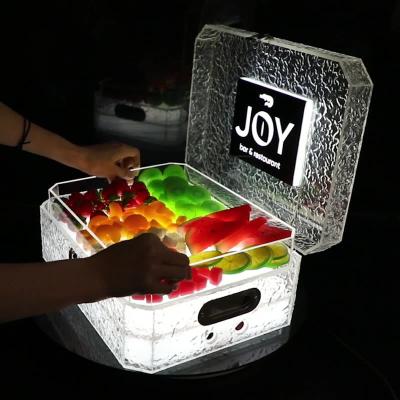 China Caja de visualización de luz de maleta acrílica para mostrar la pulsera LED Joyería aperitivos y frutas en venta