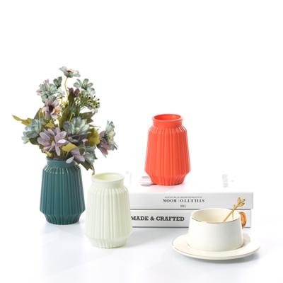 China Custom Nordic Style Minimalist China Fashion White Orange Dark Green Plastic Vase Home Decoration for sale