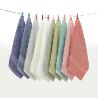 中国 factory wholesale 100 cotton hot selling colorful solid plain face wash hand towel logo can be customized 販売のため