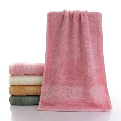 Cina 32s/2 30 cotton 70 bamboo charcoal fiber good quality ex-stock available wholesale face hand towel customized label in vendita